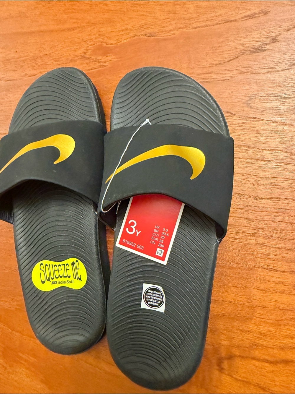 Nike Kids Black and Gold Slide Sandals